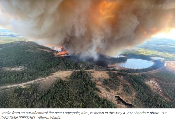Wildfires burn across Alberta, 13,000 more people forced from homes